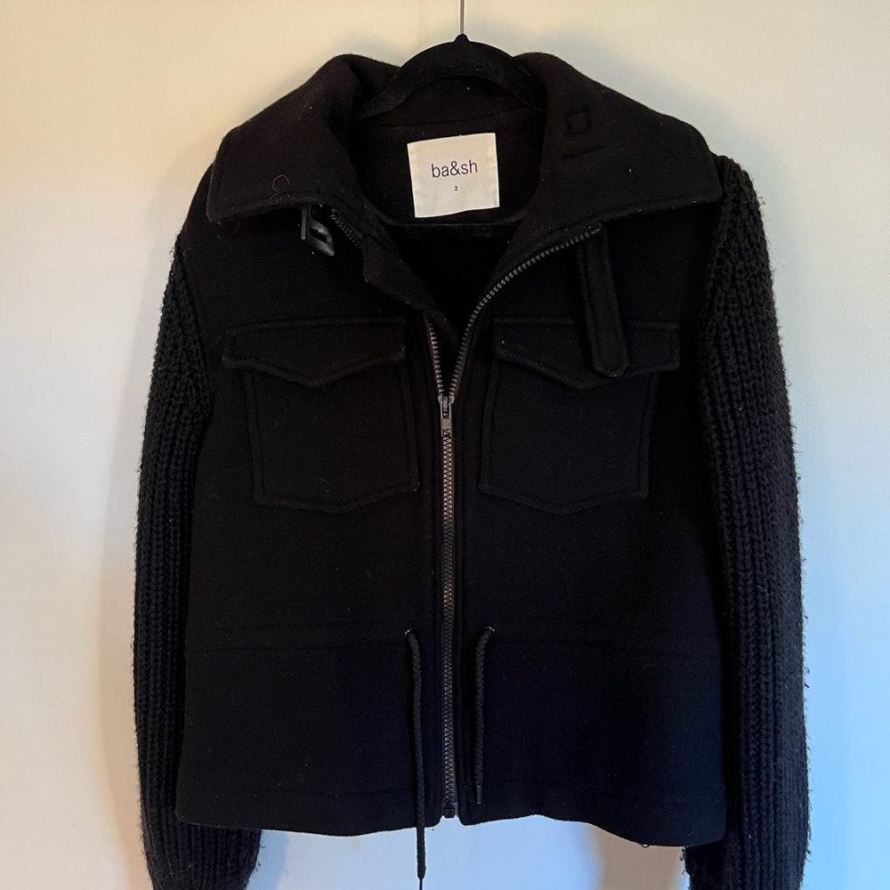 Bash jacket with knit sweater sleeves.